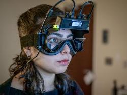 A student wears virtual reality goggles.